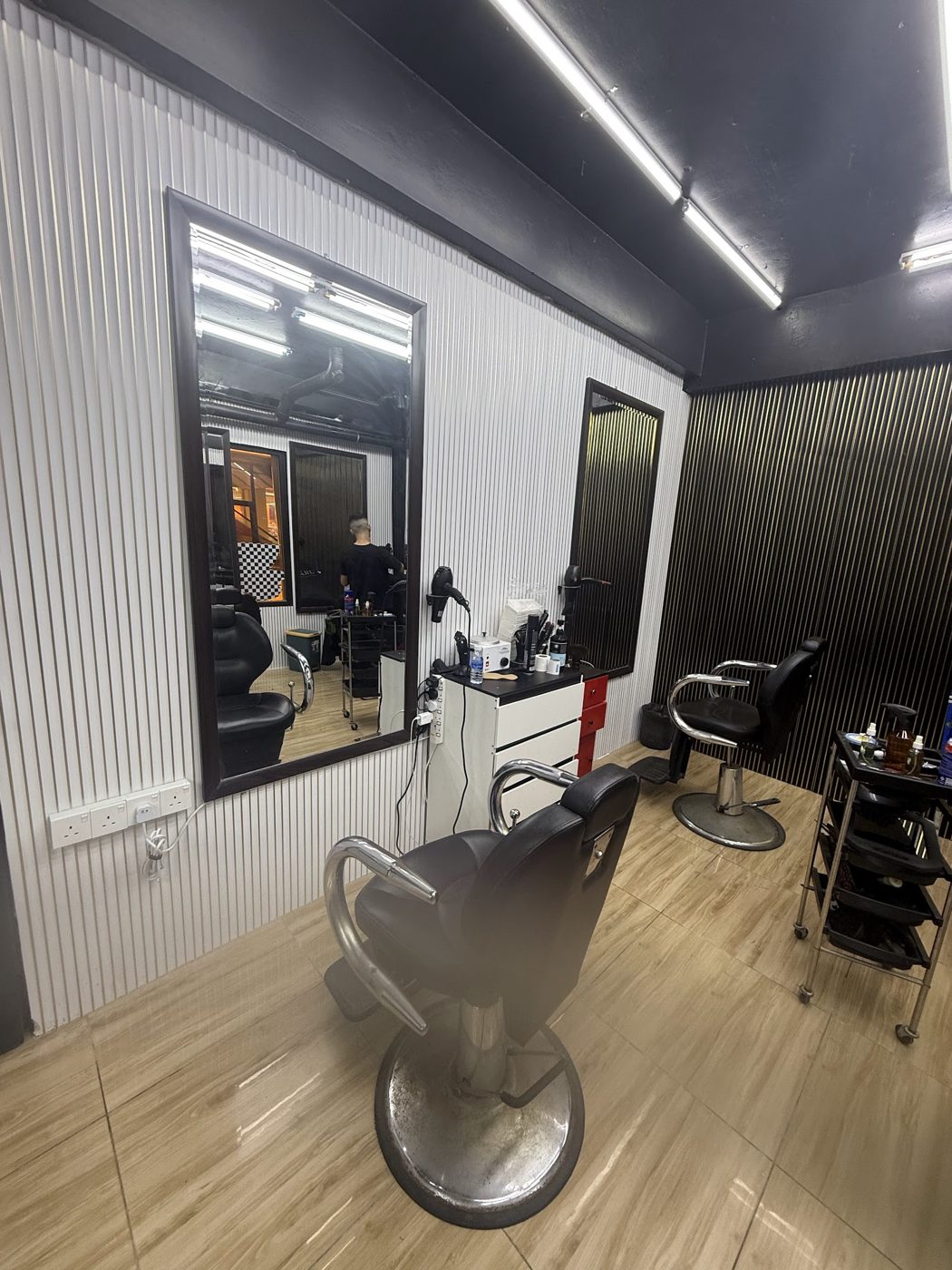 Shop interior with fluted white wall and mirror