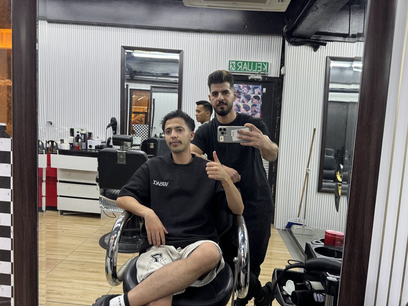 Customer and barber in the chair