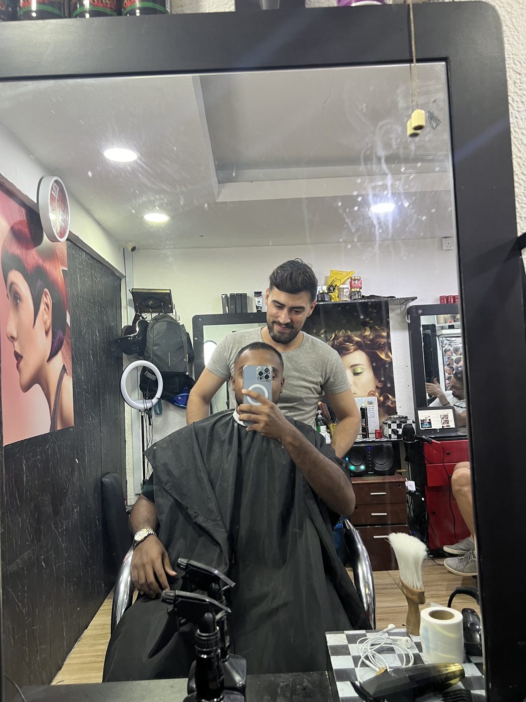 Barber and customer selfie